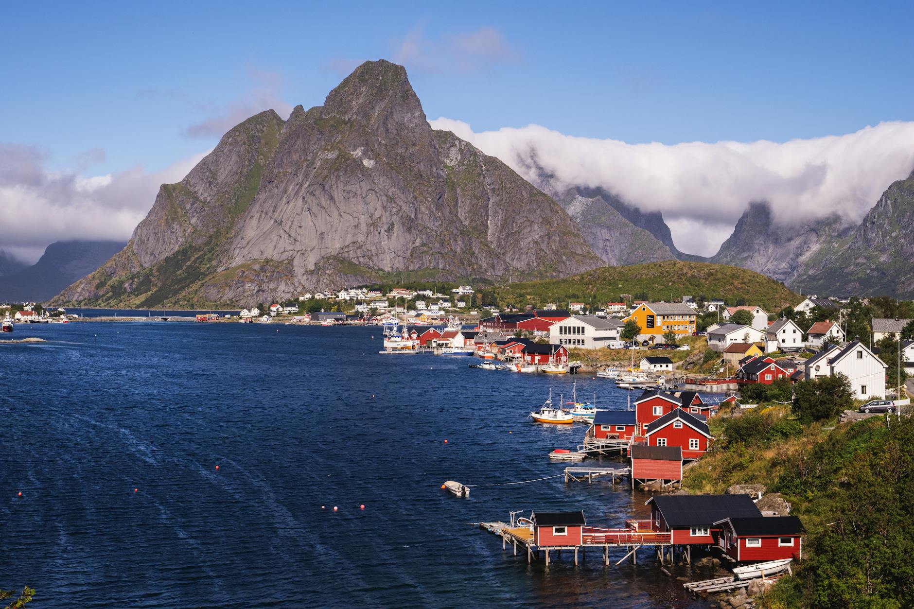 Picturesque summer view of Reine village and surrounding fjords in Lofoten Islands, Norway.
